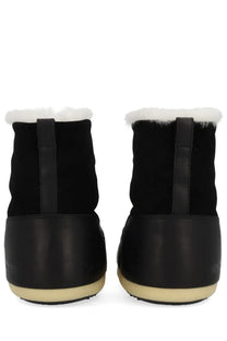 Moon Boot unisex black winter boots with black suede and rubber exterior and white faux fur lining