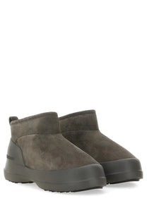 Dark olive suede ankle boots with chunky rubber sole from moon boot unisex moon boot grey collection