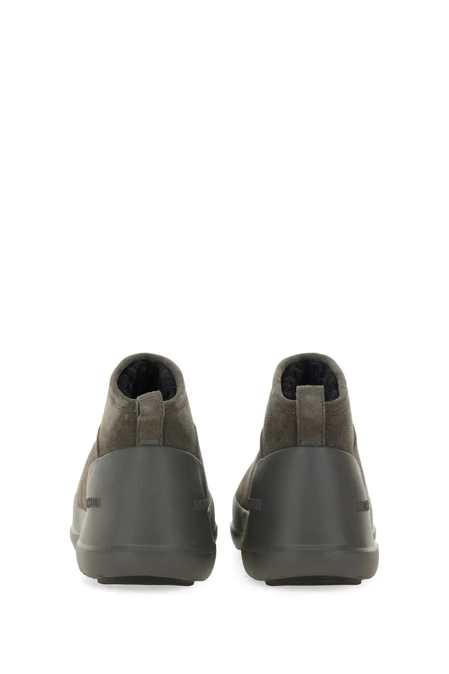 Olive green suede chukka boots with a matte rubber sole and subtle branding on the heel shown from the back side