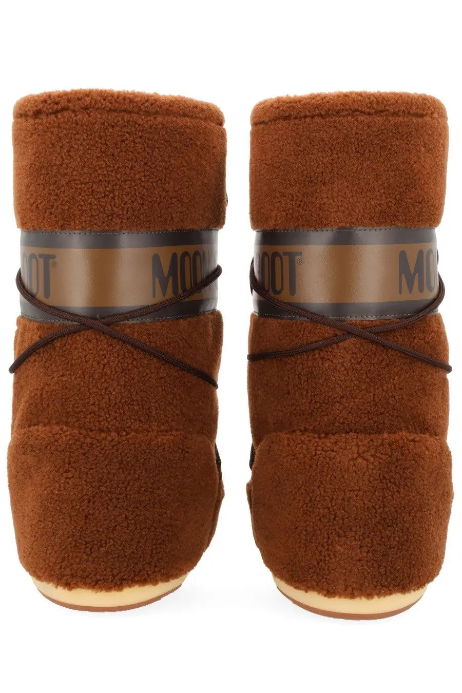 Brown fuzzy moon boot unisex icon boot with a tan and black logo band and dark brown laces