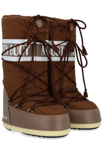 Brown moon boot unisex icon boot with tan rubber sole and white branding stripe for winter use