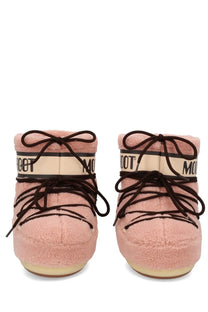 Pink fluffy moon boot snow boots with black laces and cream brand band in unisex fleece blue style