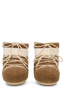 Tan moon boot unisex icon low fleece boot with shearling lining cream laces and glossy white strap