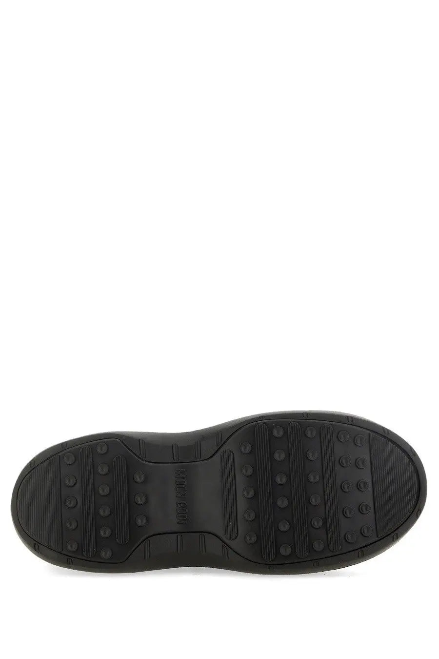 Black rubber sole of moon boot women’s moon boot black with textured tread pattern and embossed brand name in center