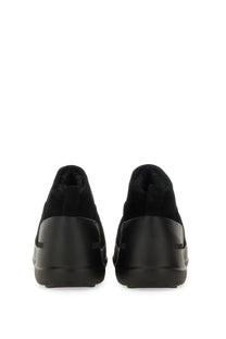 Moon Boot women’s black suede slip-on sneakers with chunky rubber sole and plush lining for comfort and style