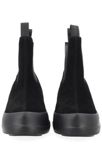 Moon boot women’s chelsea boot moon black shown from the back with black suede, chunky sole, and pull tabs