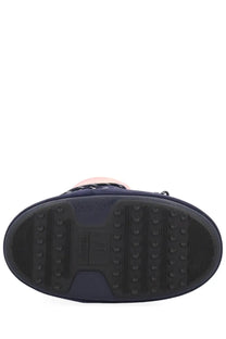 Navy blue rubber sole with textured grip pattern and embossed logo on Moon Boot women’s guest in residence boot