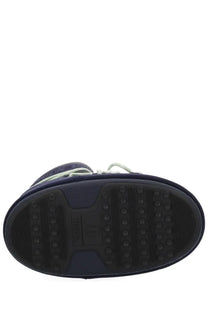 Navy blue rubber sole with textured grip and embossed moon boot logo on moon boot guest in residence women’s boot