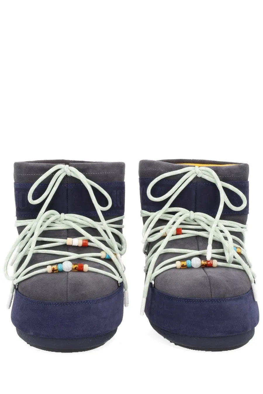 Navy blue suede moon boot with white laces and colorful beads from moon boot guest in residence collection women’s boot
