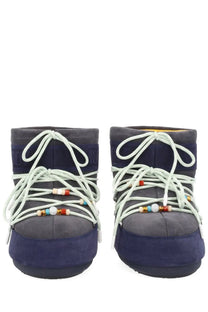 Navy blue suede moon boot with white laces and colorful beads from moon boot guest in residence collection women’s boot