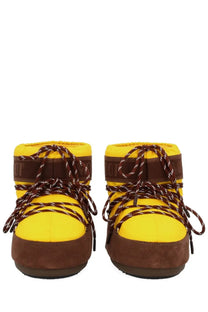 Bright yellow and brown moon boot women’s guest in residence boot with quilted upper suede accents and braided laces