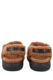 Moon Boot women’s shearling sandal brown in tan fuzzy shearling with black rubber soles and branded strap