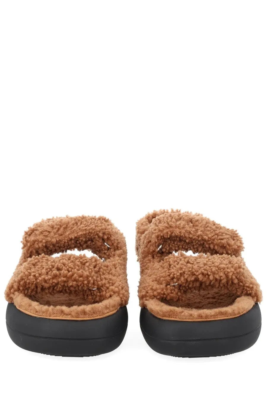 Moon boot women’s shearling sandal in tan with fuzzy upper and thick black rubber sole for casual wear