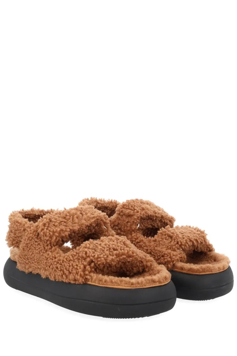 Moon boot women’s shearling sandal in tan with black platform sole featuring soft shearling material