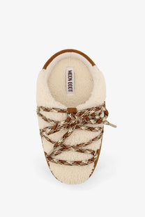 Cream-colored moon boot women’s shearling-lined suede slip-on boot with brown cream patterned laces and moon boot label inside