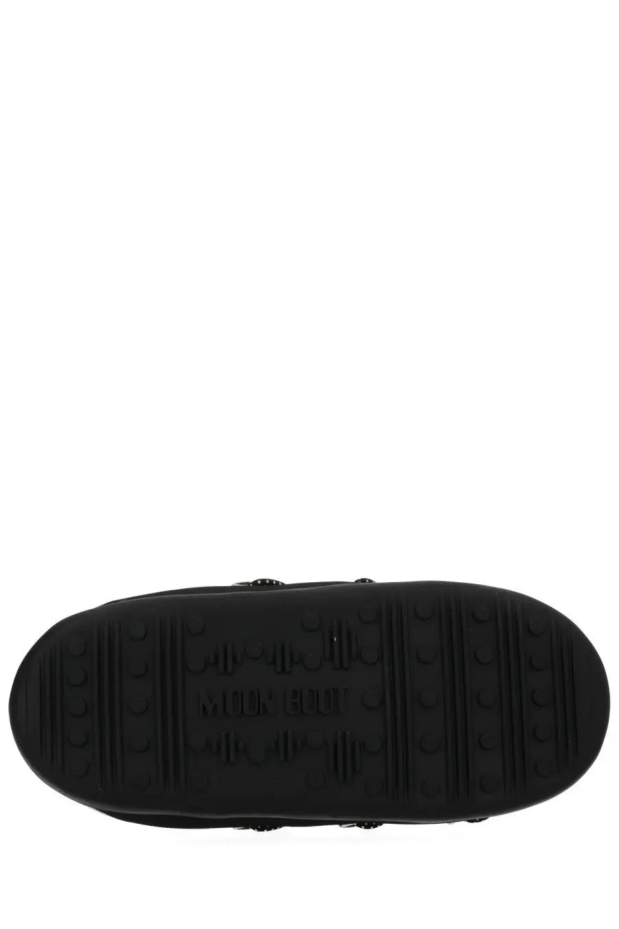 Black rubber sole of moon boot women’s soft slipper shoe beige with embossed branding and textured tread pattern