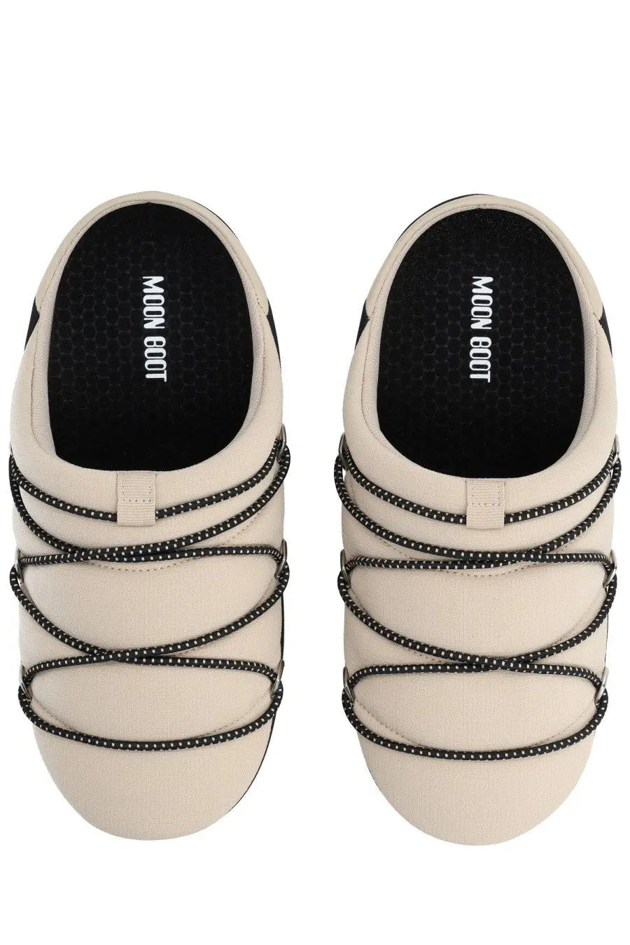 Cream-colored moon boot women’s soft slipper shoe with black dotted lace-up slip-on straps in beige