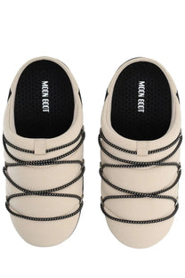 Cream-colored moon boot women’s soft slipper shoe with black dotted lace-up slip-on straps in beige
