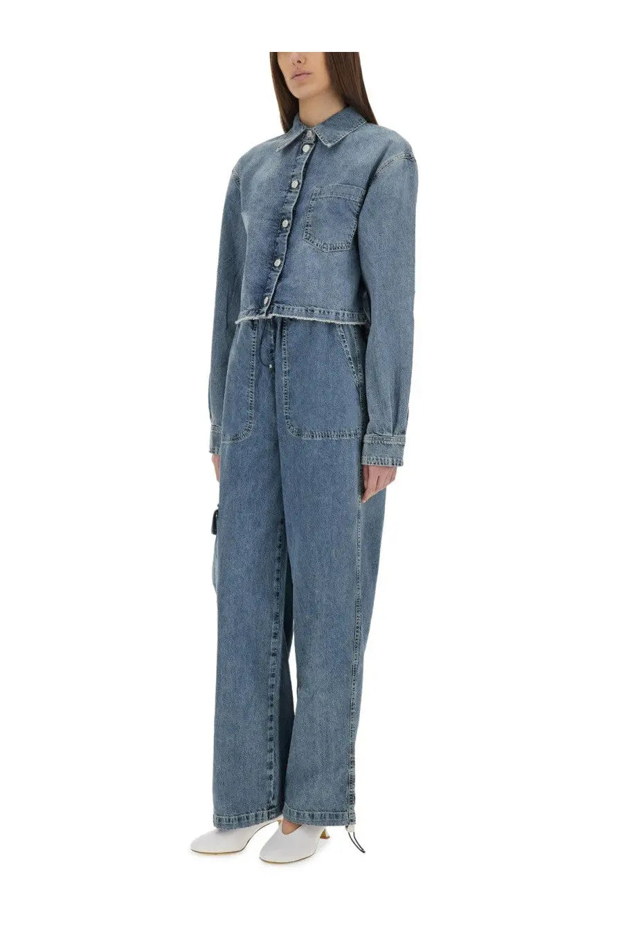 A light-wash denim jumpsuit with a button-up shirt top and wide-leg pants by moschino jeans in blue