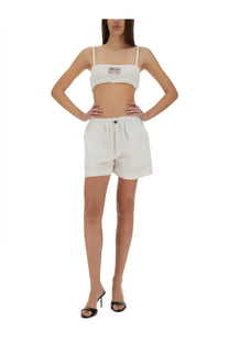 White cotton cropped bandeau top with thin straps frayed hem and small Moschino Jeans logo patch on front