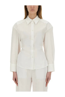A crisp white long-sleeved Moschino Jeans cotton blouse with a structured collar and peplum hem