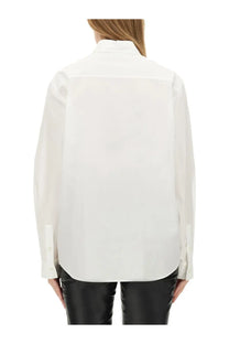A crisp white moschino jeans womens cotton shirt with long sleeves classic collar and subtle back pleats shown from the back