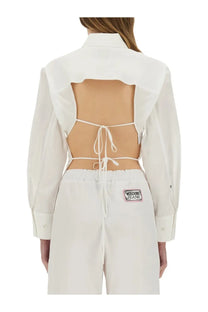 Back view of moschino jeans women’s white cotton cropped button-up shirt with cutout and tie details
