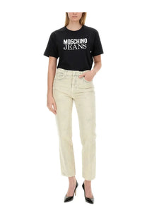 Black moschino jeans t-shirt with white lettering and short sleeves paired with moschino jeans womens cropped blue jeans
