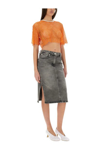 A gray denim skirt with a front slit and classic stitching details paired with a moschino jeans women’s cropped mesh top orange