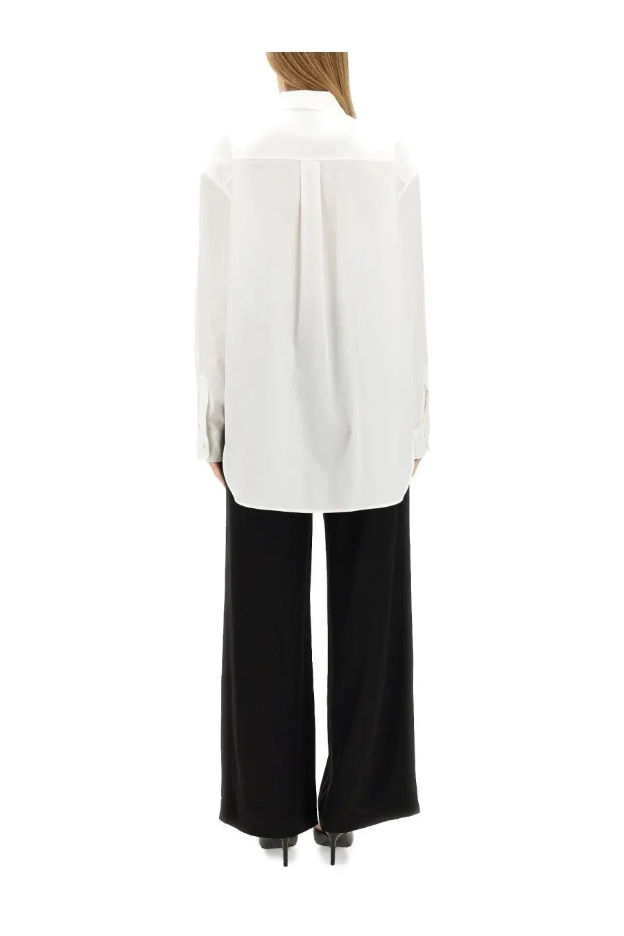 Moschino Jeans women’s white oversized button-down shirt with relaxed fit and long sleeves featuring a heart patch