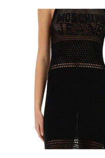 Moschino Jeans women’s black mesh halter dress with a sleek form-fitting silhouette and shimmering hemline accents