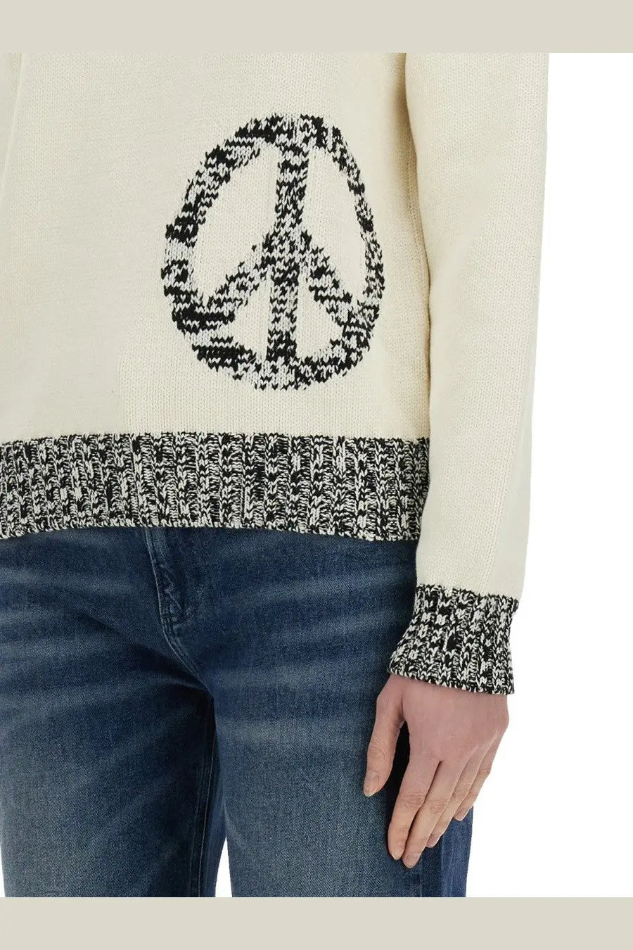 Cream-colored knit Moschino Jeans women’s sweater with black and white peace sign and speckled trim on hem and cuffs