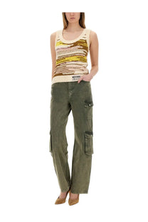 Olive green cargo pants with multiple pockets and relaxed fit paired with moschino jeans women’s multicolor knit top multicolor