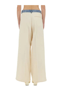 Cream-colored wide-leg trousers with denim waistband from moschino jeans women’s urban white pants collection