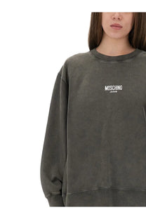 Dark gray slightly faded cotton sweatshirt with white moschino jeans logo embroidered on the chest for women