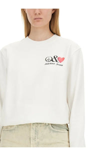 Moschino Jeans women’s white long-sleeved cropped sweatshirt with black peace symbol and pink heart embroidery
