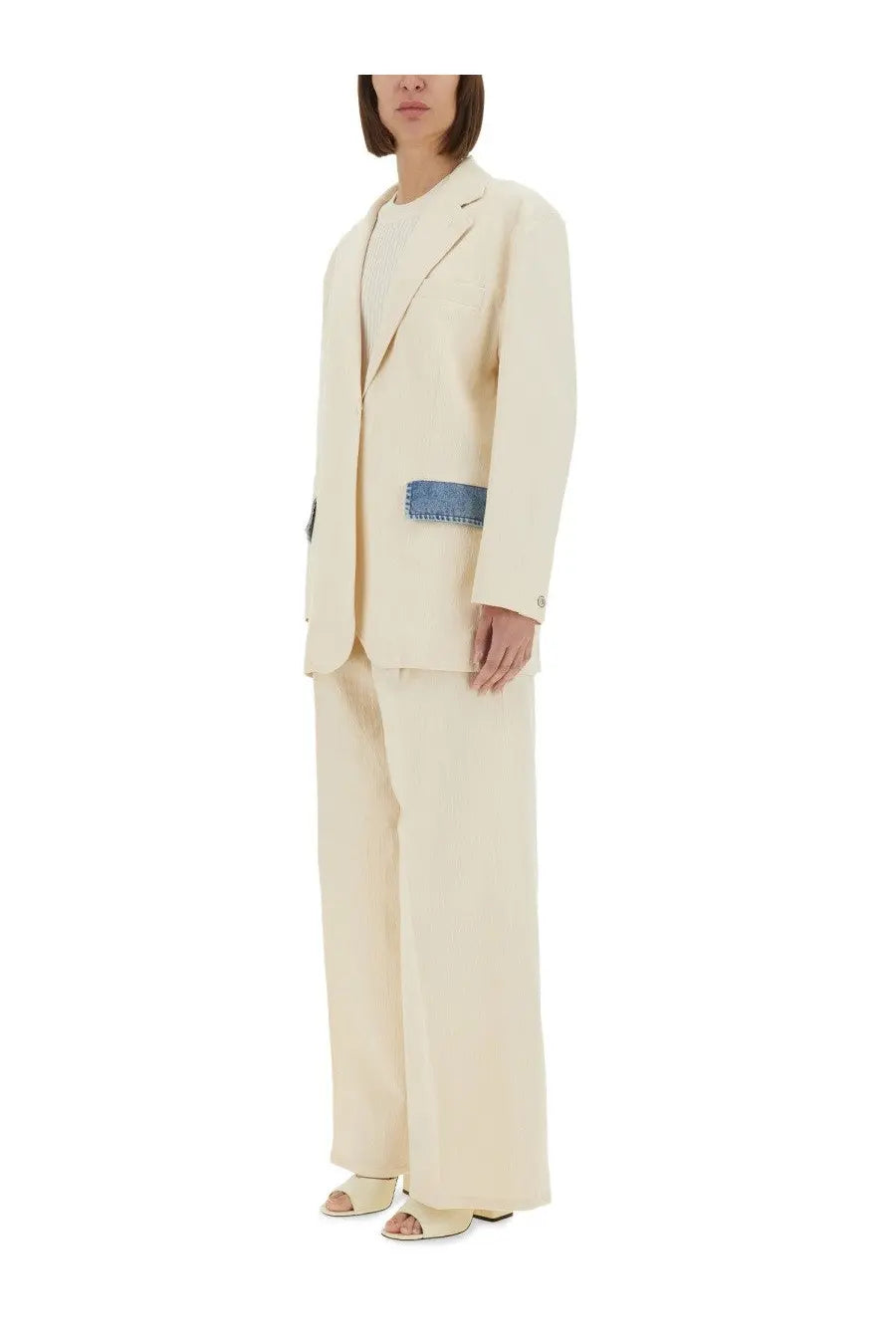 Cream-colored wool-blend Moschino Jeans women’s urban blazer with distinctive blue denim patch on left side seam