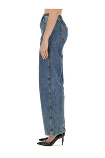 Moschino wide-leg women’s jeans in medium-wash blue denim with visible stitching and elastic waistband