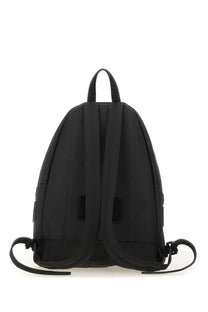 Moschino men’s backpack black made of sleek black nylon with minimalist design and adjustable shoulder straps shown from back