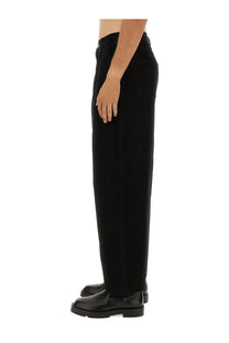Moschino men’s barcode pant black featuring wide-leg tailored trousers with subtle waistband pleats in black fabric