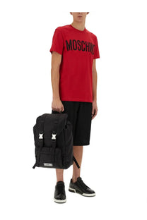 Moschino men’s Bermuda black backpack with silver-tone buckles and front patch logo in leather material