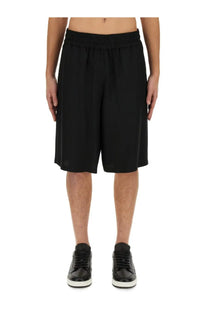 Moschino men’s bermuda black loose-fitting shorts with elastic waistband made from lightweight fabric