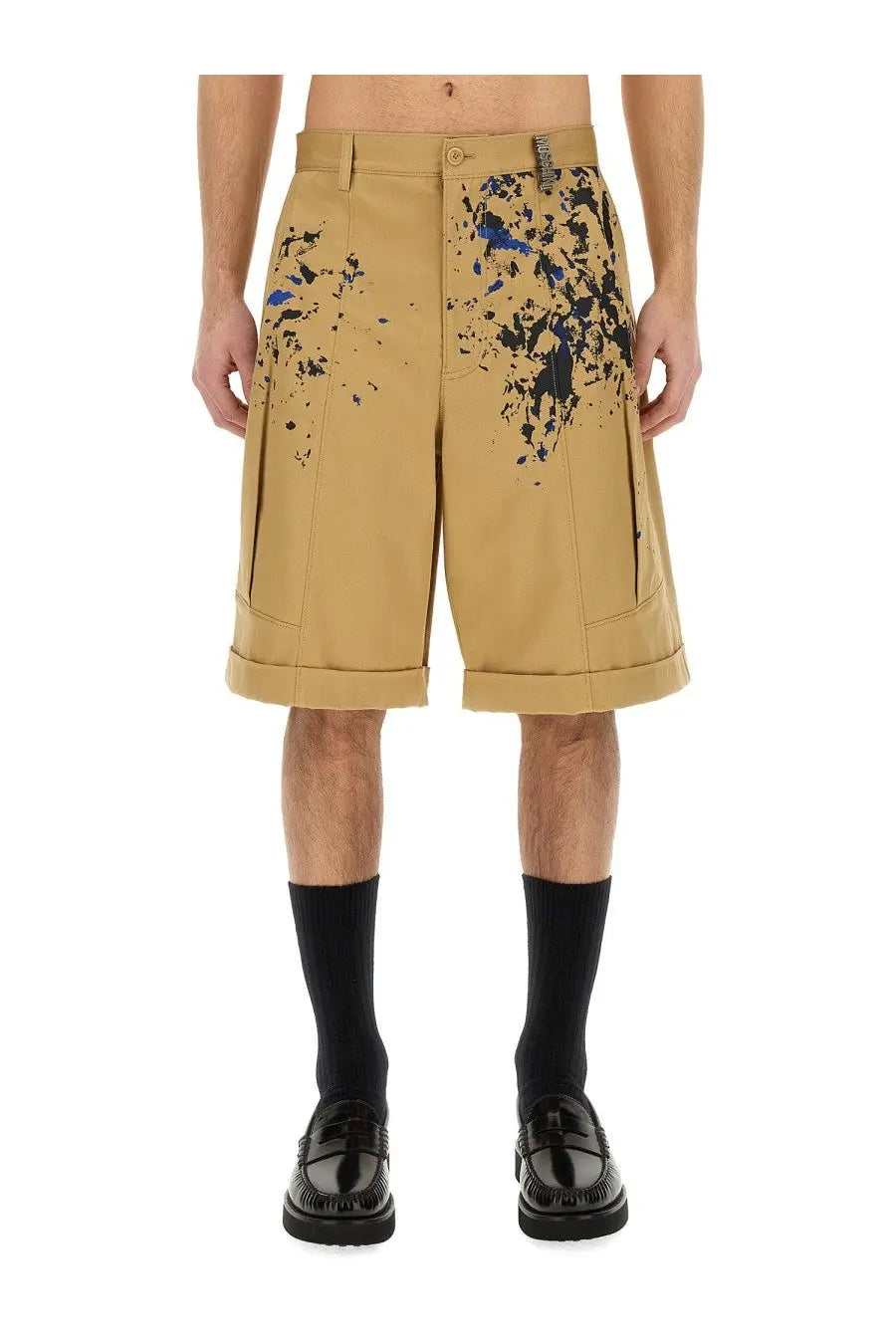 Moschino men’s bermuda cargo beige shorts with bold blue and black paint splatter design on durable fabric
