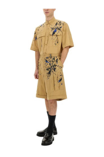 Moschino men’s bermuda cargo beige tan canvas short-sleeved shirt dress with black and blue paint splatter and chest pockets