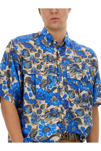Moschino men’s blue floral print short-sleeved button-up shirt with beige brown accents and two front pockets