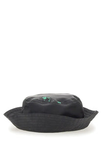 Moschino men’s black bucket hat with glossy crown and green paint splatter detailing