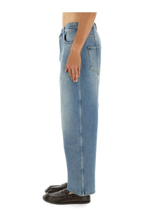 Moschino men’s cotton denim jeans in blue with a light-wash relaxed wide-leg cut and classic front pockets