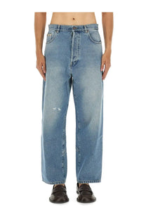 Moschino men’s cotton denim jeans in blue with a relaxed wide-leg cut and subtle thigh distressing