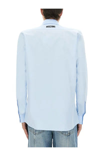 Light blue moschino men’s cotton poplin long-sleeved dress shirt with black logo at the collar