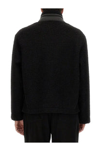 Moschino men’s black shearling jacket with high collar and soft textured fleece material